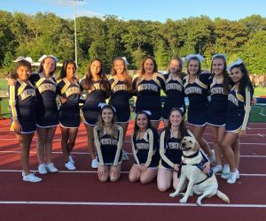 community service dog with cheerleaders